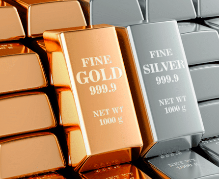 Stacks of shiny gold and silver bars, each labeled with "FINE GOLD 999.9 NET WT 1000 g" or "FINE SILVER 999.9 NET WT 1000 g," arranged closely together.