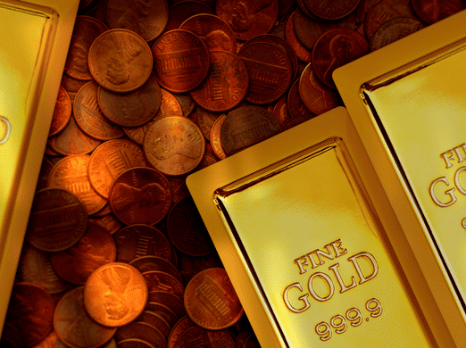 Gold bars labeled "FINE GOLD 999.9" rest on a surface covered with scattered copper pennies. The image highlights the contrast between the gold bars and the coins.